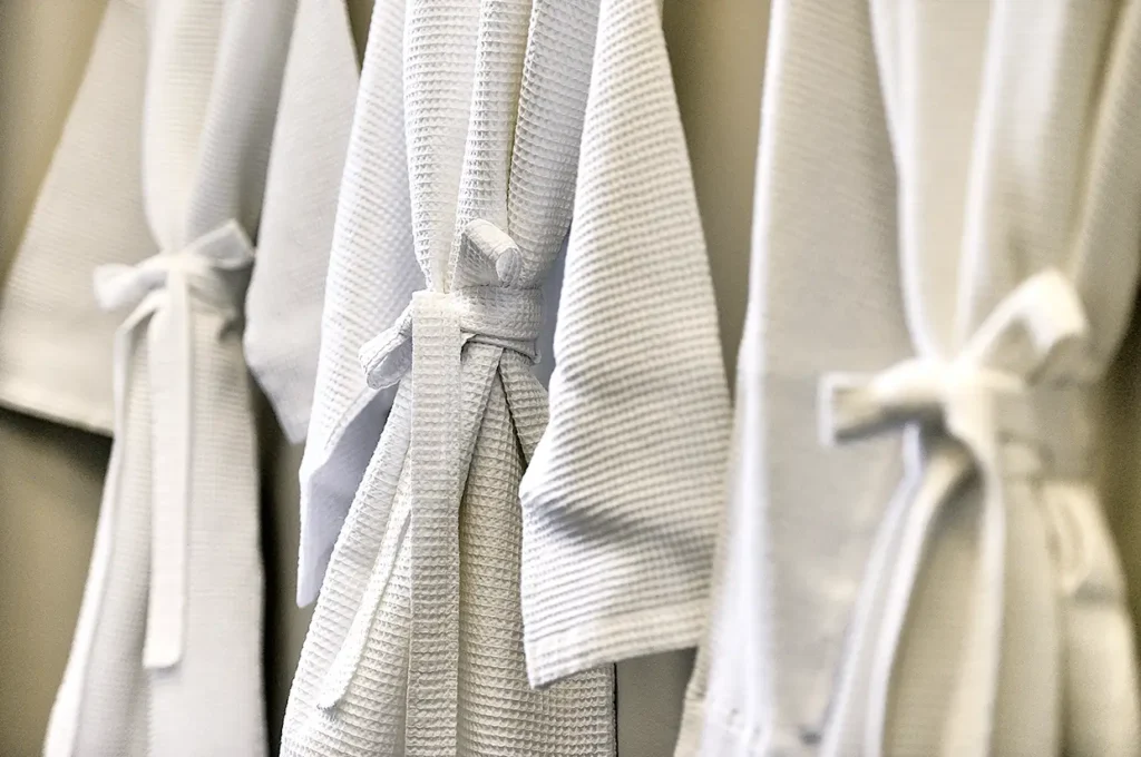 Guest-ready vacation rental bathroom with folded towels and organized amenities in Santa Fe, NM